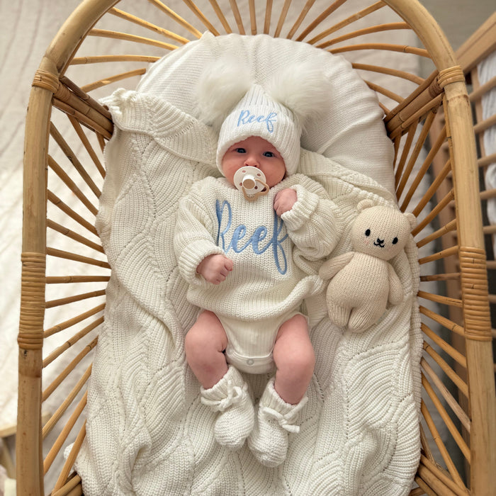 Baby knitted jumper and hat set, white, with script 'Reef' and knitted bunny