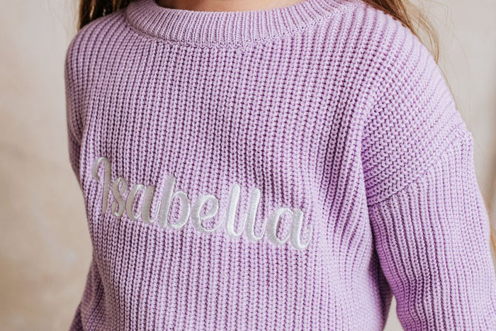 Lilac knitted jumper back with embroidered name across upper back, ribbed collar