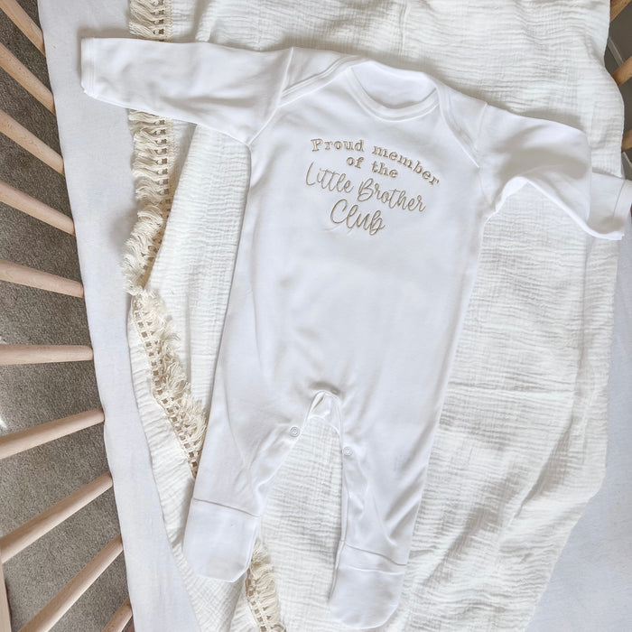 White baby long-sleeve romper with “Little Brother Club” front print and snaps
