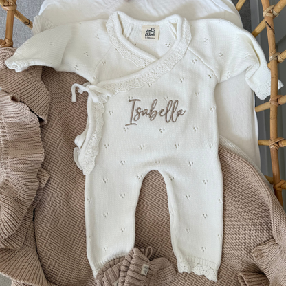 White pointelle kimono romper with front tie waist and embroidered “Isabella” name detail.