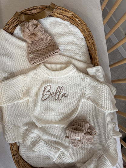 Baby white chunky knit jumper with Bella embroidery and front bow detail