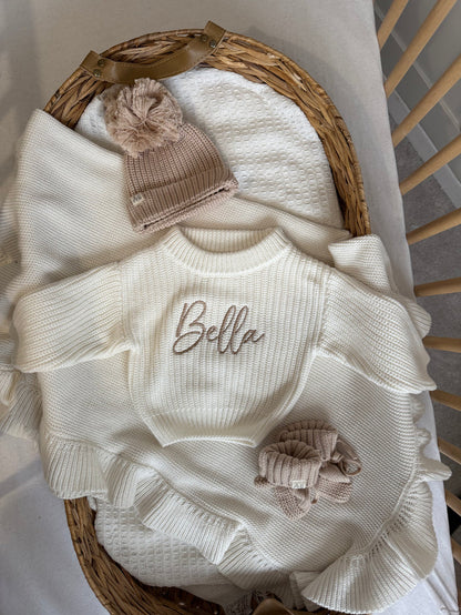 Baby white chunky knit jumper with Bella embroidery and matching bow cuffs