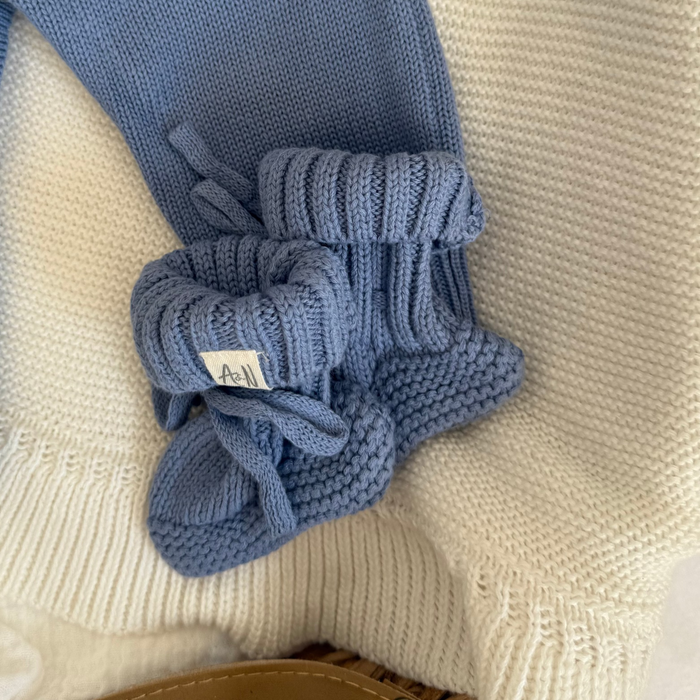 Blue knitted baby booties, folded toe and braided cuff detail