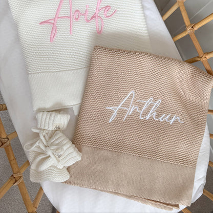 Baby beige knit blanket with embroidered name 'Arthu' and white tied corner detail