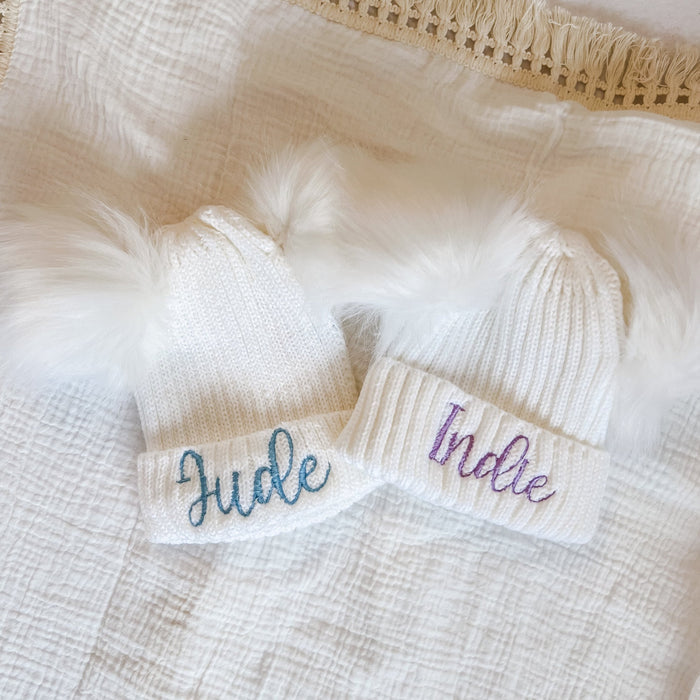 Baby knitted hat band close-up with “Indie” embroidery and ribbed knit cuff