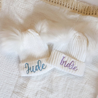 Baby knitted hat band close-up with “Indie” embroidery and ribbed knit cuff