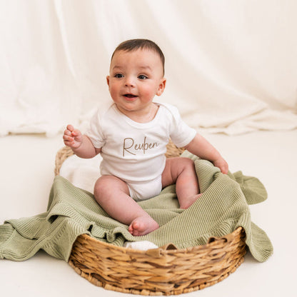 Personalised script baby vest, white with brown Reuben print