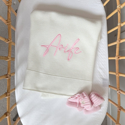 White baby blanket with pink “Arfie” embroidery on textured knit panel
