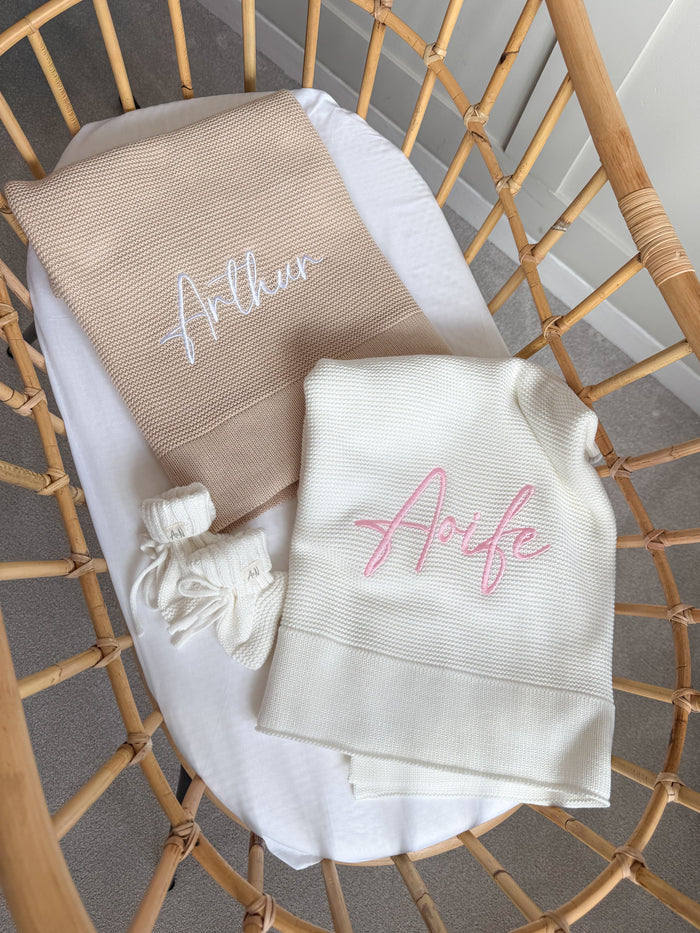 Two baby blankets with name embroidery: “Arfie” white and “Arfie” on grey