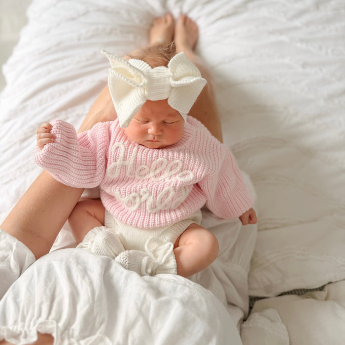 Baby pink chunky knit jumper with "hello world" lettering, ribbed crew neck and hem