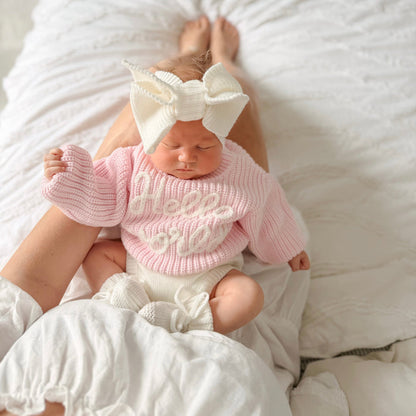 Baby pink chunky knit jumper with "hello world" lettering, ribbed crew neck and hem