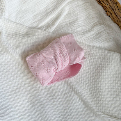 Baby pink pointelle bow headband with layered bow detail