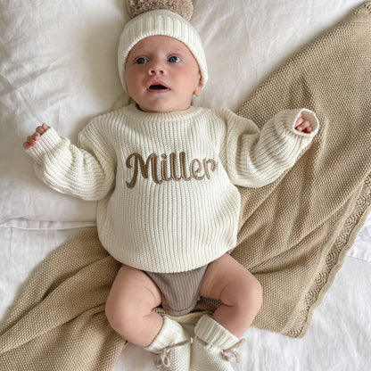 Baby chunky knitted jumper, off-white, with brown 'Miller' script on front