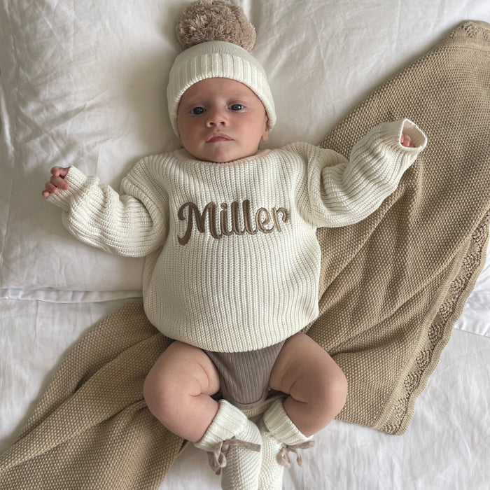 Baby off-white chunky knit jumper with 'Miller' personalized script across chest