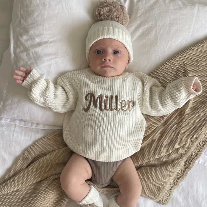 Baby off-white chunky knitted jumper with long sleeves and 'Miller' script