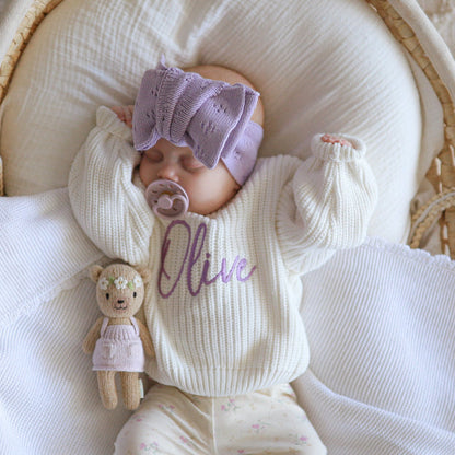 Newborn white chunky knit jumper with Nive script and mauve hat