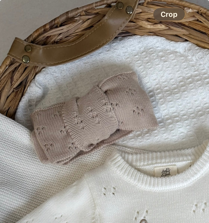 Beige knitted headband with pointelle knit bow detail