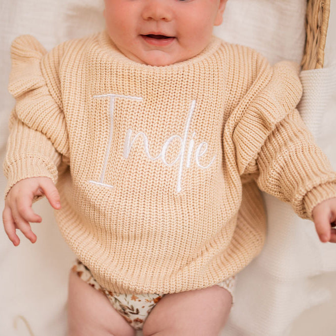 Beige knit jumper with frill sleeves and 'Katie' embroidery on the front