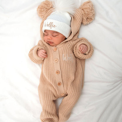 Beige knit romper with hood and pom beanie hat, beanie 'Wolffie' in light blue knit