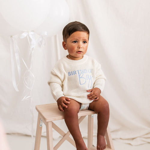 White knitted jumper with blue Birthday Boy print, on child