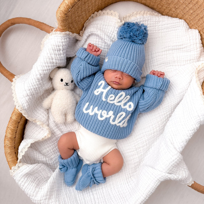 Blue chunky knitted baby jumper with 'Hello world' print and long sleeves