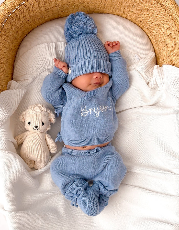 Blue knitted baby kimono set with pom-pom beanie, name Bryson embroidered