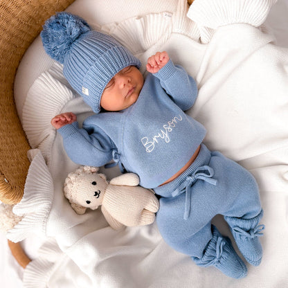 Blue knitted baby kimono set with pom-pom hat and Bryson name on chest