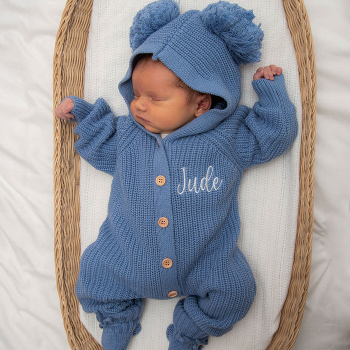 Blue knitted romper with hood and pom-pom cap, button front, “Jude” name