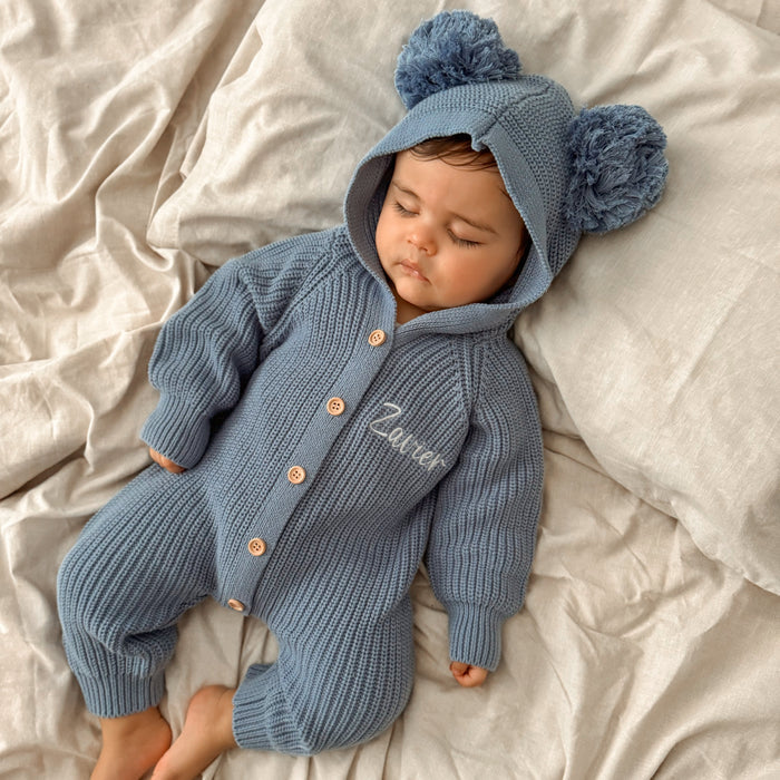 Blue knit hooded romper with pom-poms and button front, 'Ziver' embroidery