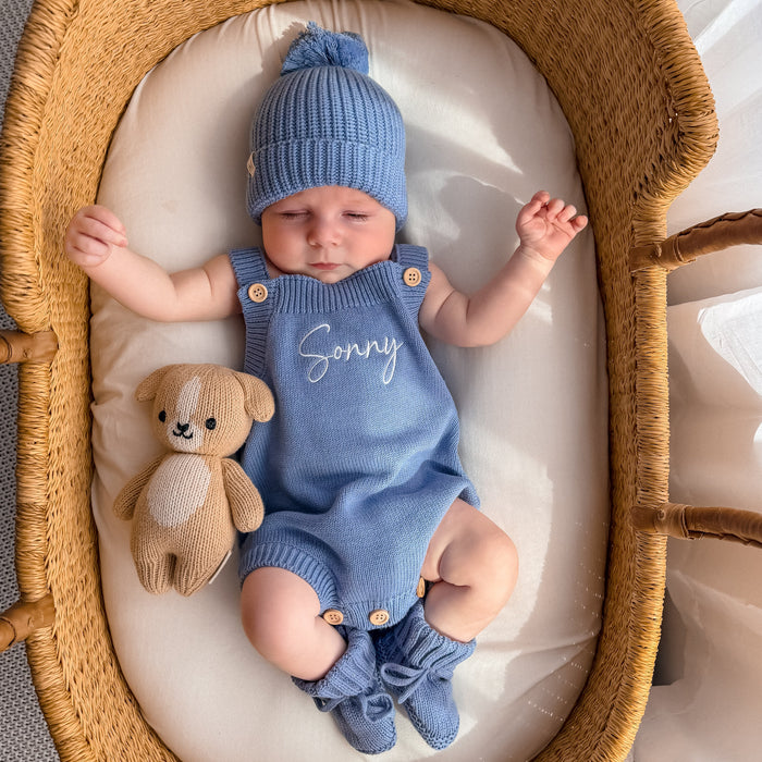 Blue knit personalised summer romper with button straps and matching blue beanie