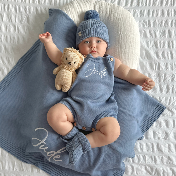 Blue knit personalised romper set with matching beanie and teddy plush