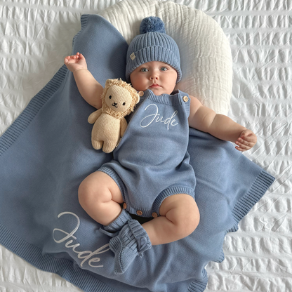 Blue knit personalised romper set with matching beanie and teddy plush