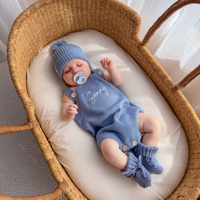Blue knit personalised romper with bow-tie booties and matching blue beanie