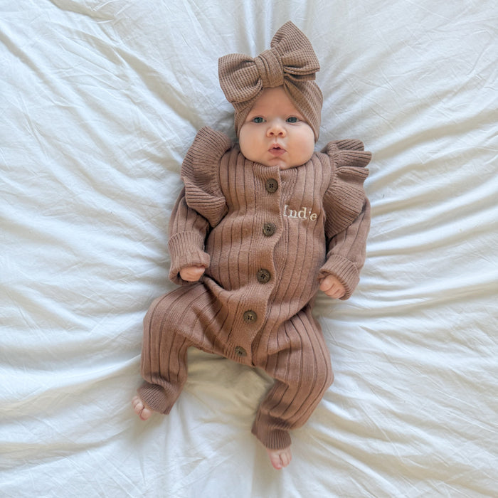 Brown ribbed baby romper with frill sleeves and bow headwrap, 'Indie' button placket