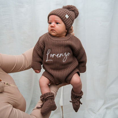Dark brown knitted romper with matching beanie and pom-pom, 'lorenzo' front