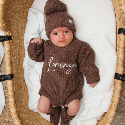 Dark brown knitted baby romper with matching beanie pom-pom, 'lorenzo' front detail