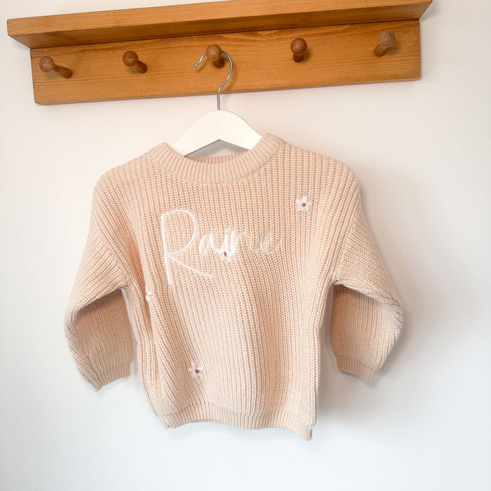 Cream knitted jumper with long sleeves, crew neck, and white script name with small dots