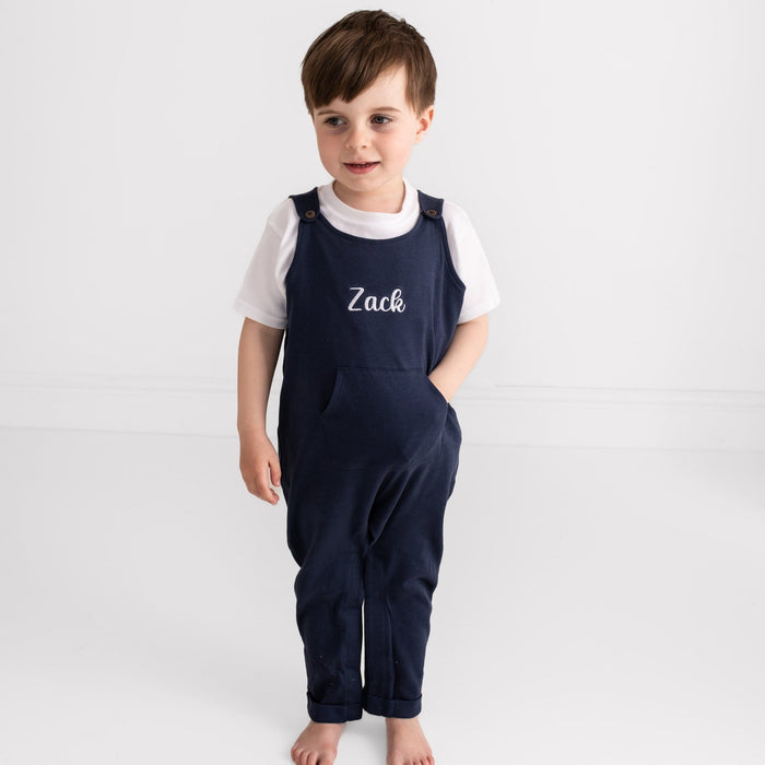 Navy embroidered name dungarees with 'Zack' on front, worn over white T-shirt