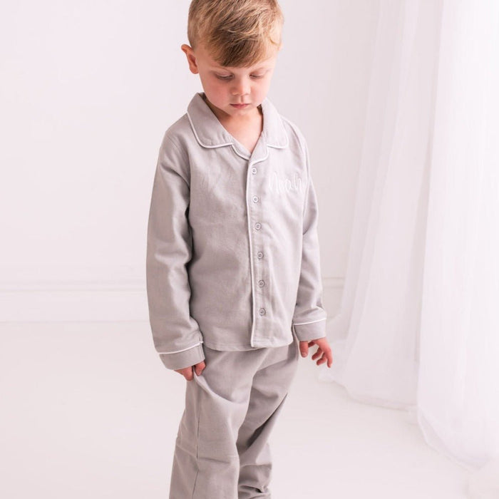 Grey long-sleeve pajama shirt with button front and white trim, embroidered 'Noah'.