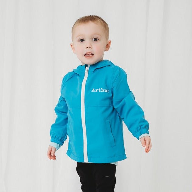 Lightweight personalised rain coat in blue, front zip hooded jacket for toddler.