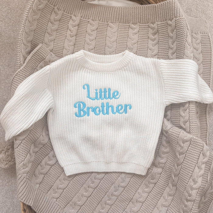 Personalised knitted jumper, white knit crewneck with light blue Little Brother front