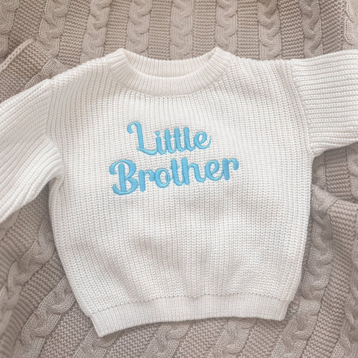 Personalised knitted jumper, white crewneck with light blue Little Brother on chest