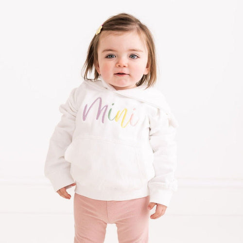 Kids white hoodie with purple-pink 'Mini' script embroidery