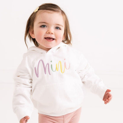 Kids white hoodie with 'Mini' script embroidery at chest, long sleeves