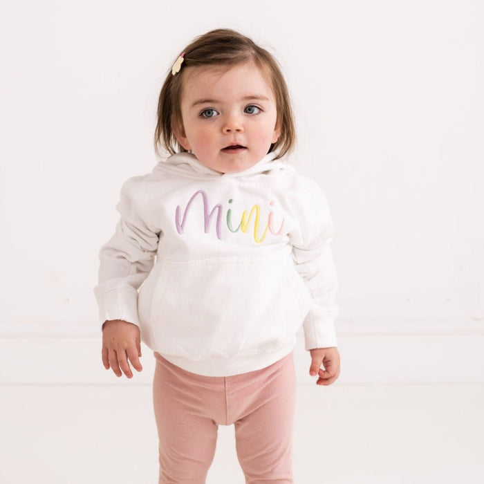 Kids white hoodie with 'Mini' embroidered script on front pocket area