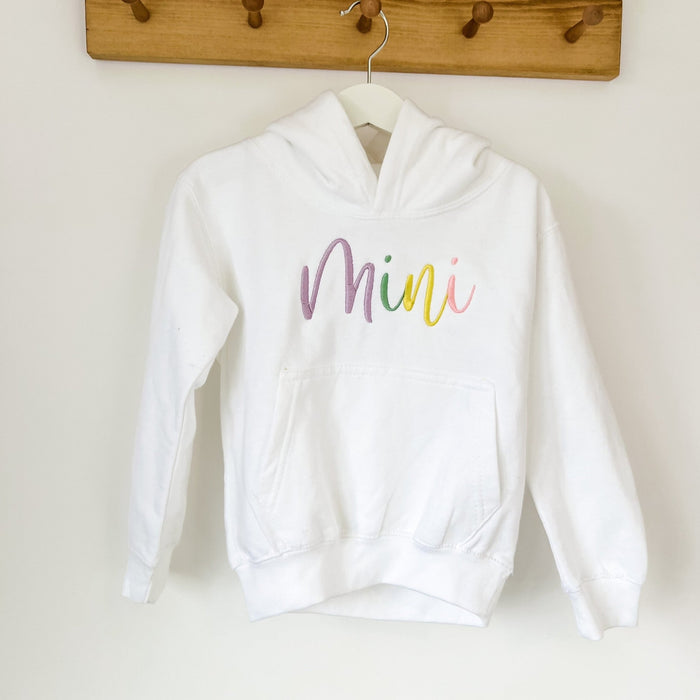 White hoodie with 'Mini' script embroidery and front kangaroo pocket, hooded