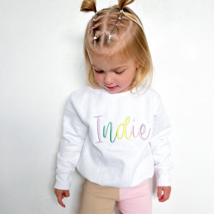 White sweatshirt with multicolor embroidered name Indie on front
