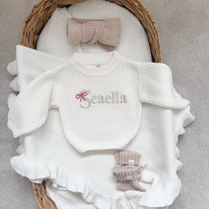White chunky knitted jumper with ruffle sleeves, front bow-name logo 'Beaella'
