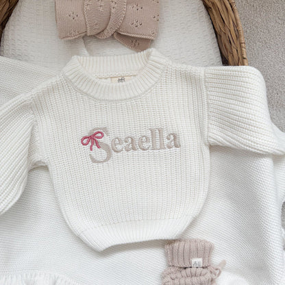 White knitted jumper with 'Beaella' bow-name embroidery, textured knit and ribbed collar