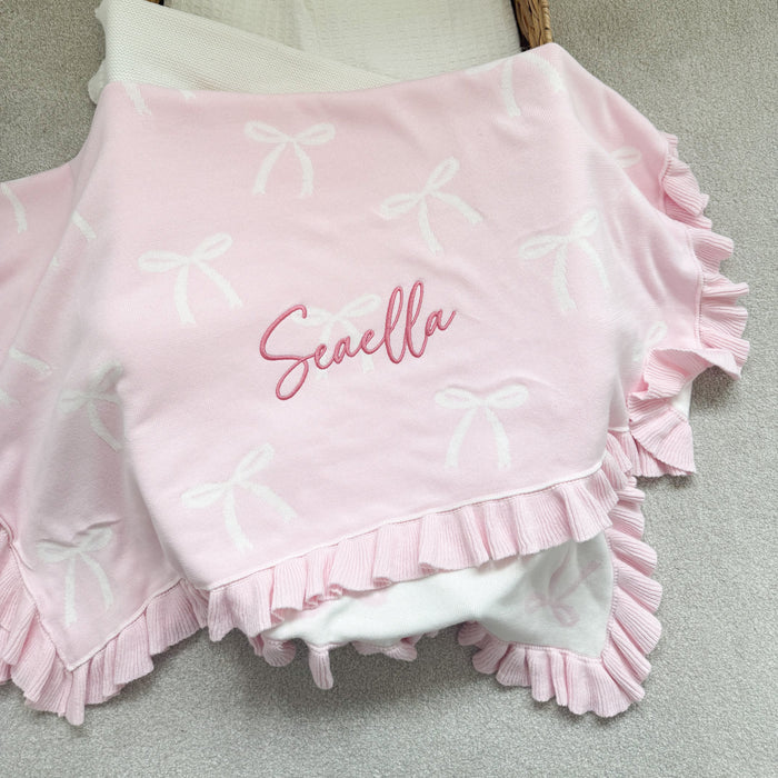 Personalised bow reversible blanket, pink bow print with Seavella text and frilled border